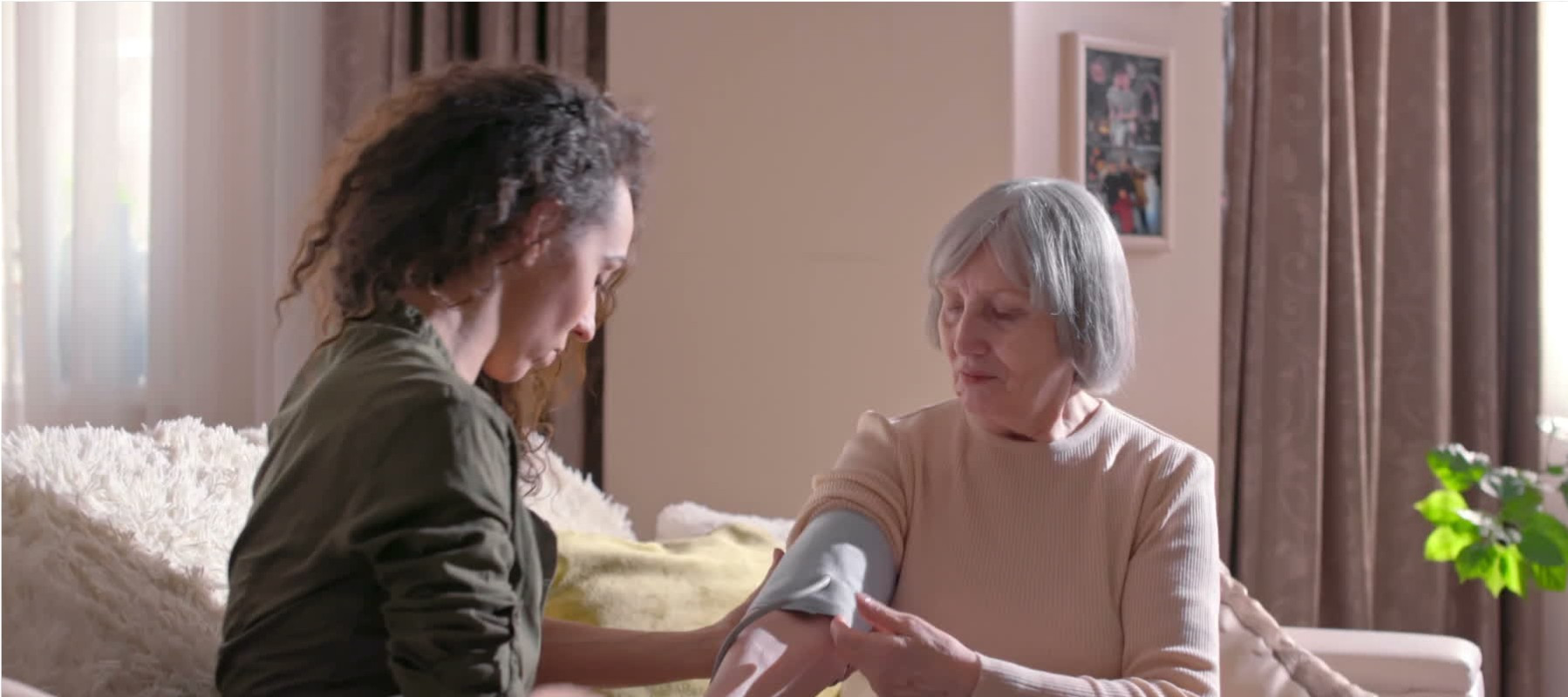 A nurse taking the blood pressure of a patient